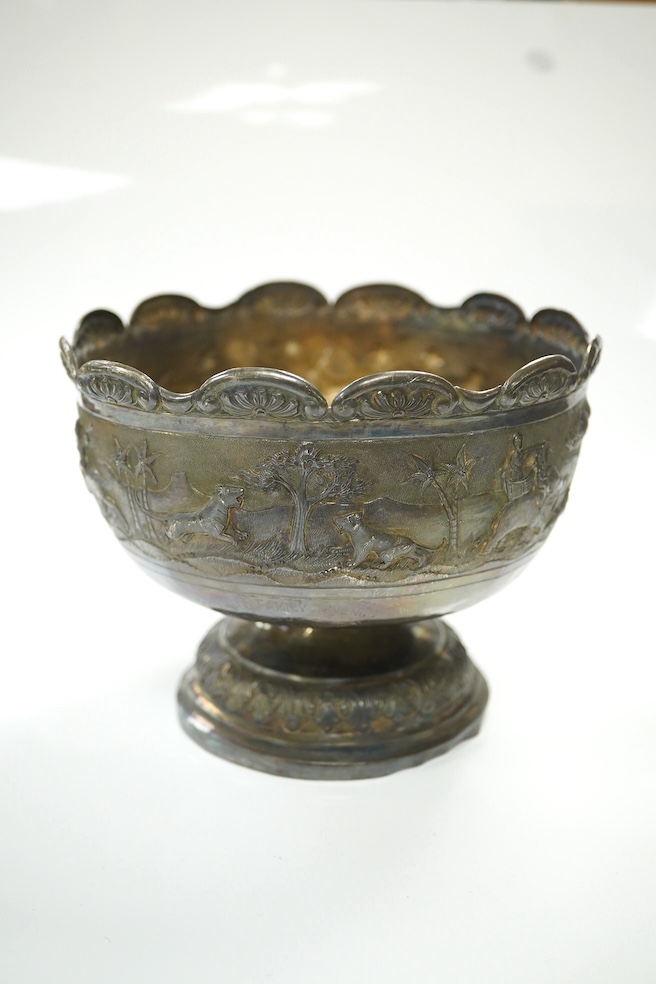 Two early to mid 20th century Indian white metal pedestal bowls, including one embossed with continuous hunting scene, diameters 14.2mm and 13.8mm, 18.1oz. Condition - poor